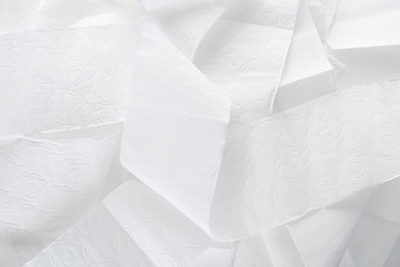Obraz premium Miękki papier toaletowy jako tło, widok z góry. Higiena osobista