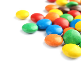 Pile of colorful candies on white background
