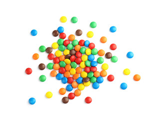 Tasty colorful candies on white background, top view