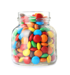 Jar with colorful candies on white background