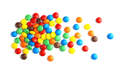 Tasty colorful candies on white background, top view