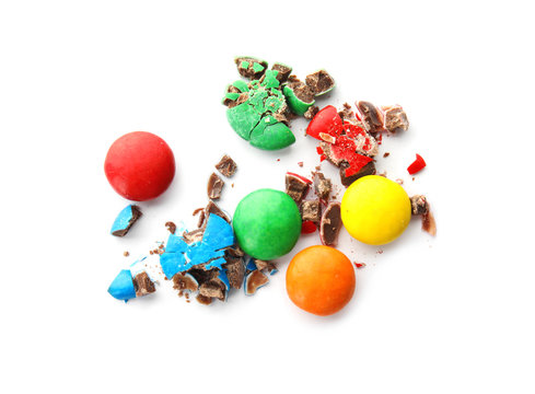 Crushed candies on white background, top view