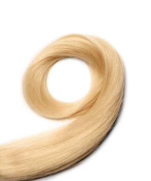 Lock of healthy blond hair on white background