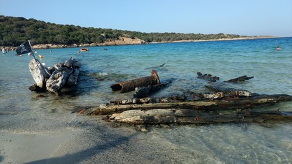 pirate flag over a destroyed ship in mediterranean beaches