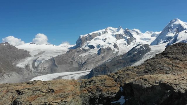 Aerial view of the Monte Rosa Alps with glaciers in Zermatt, Switzerland, forward flight