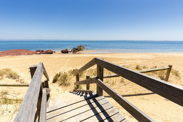 Timber stairs to Red Rocks Beach on a sunny day, Phillip Island, Victoria, Australia