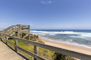 Timber stairs to Red Rocks Beach on a sunny day, Phillip Island, Victoria, Australia
