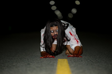 Portrait of asian woman make up ghost face with blood,Horror scene,Scary background,Halloween...