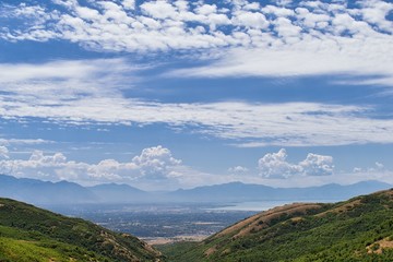Panoramic Landscape view from Travers Mountain of Provo, Utah County, Utah Lake and Wasatch Front Rocky Mountains, and Cloudscape. Utah, USA.