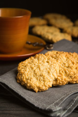 Sweet cookies with oat on tissue with tea or coffee