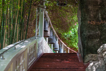 a bell hangs along the way the ladder areas a temple in Thailand