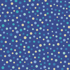 Seamless vector abstract pattern with circles scattered random in yellow and blue colors