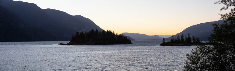 Panoramic landscape view of a beautiful Pacific Ocean Inlet during a vibrant summer sunset. Taken...
