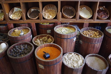 Large choice of dry spices in a traditional shop full of colors and flavors.
