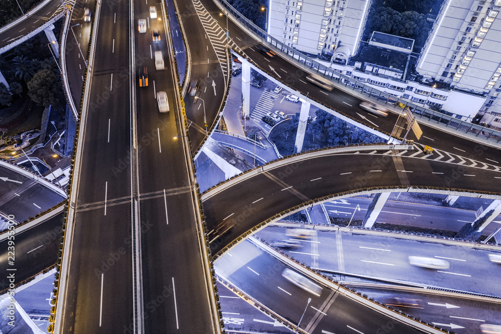 Wall mural aerial view of highway interchange at night