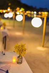 Abstract blur image of Outdoor Cafe or restaurant in night time with bokeh for background usage . (vintage tone)