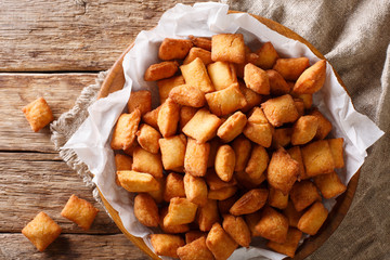 Chin Chin – West African Fried pastry enjoyed throughout the region especially in Nigeria - Crispy Crunchy and Addictive closeup in a bowl. Horizontal top view