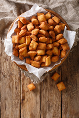 Chin chin is a fried snack in West Africa, mostly in Nigeria served in a plate on a close-up. Vertical top view