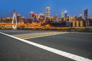 Fototapeta na wymiar Road pavement and Chongqing urban architecture skyline