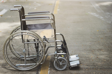 Empty wheelchair parked in hospital