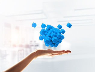 Cube color figure in male palm as symbol for integration. 3D rendering