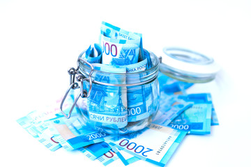 Paper Russian Money. New Russian Banknotes Of 2000 Two Thousands Rubles Close Up in glass jar on...