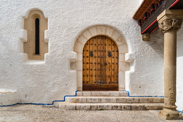 Wooden door of Maricel Palace in Sitges, Spain