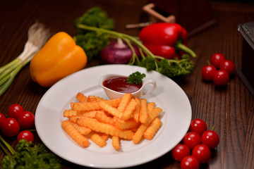 French fries with sauce on a white plate