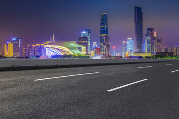 Naklejka premium Road pavement and Guangzhou city buildings skyline