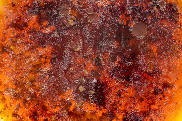 Stains of fat on the surface of water abstraction. Creative rough textured background