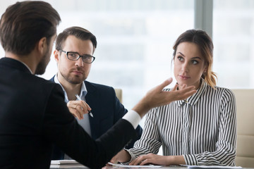 Suspicious recruiters dislike self-confident male job candidate talk at interview, man applicant or...