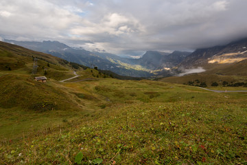 Fototapeta premium Cloudy sunset in mountains
