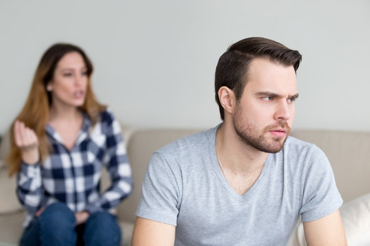 Annoyed husband tired of constant wife disagreement and lecturing, thoughtful man thinking about break up or separation with lover bothered by woman pressure. Relationships problem concept