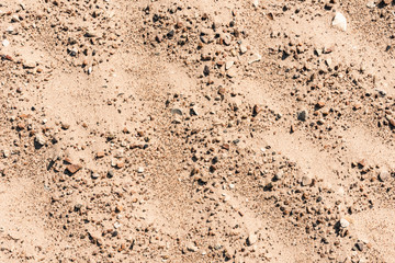 Sand with small stones - natural background with copy space