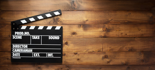 movie clapper board at wooden background