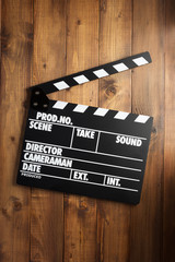 movie clapper board at wooden background