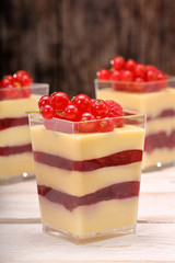Cream pudding with red currants and raspberries