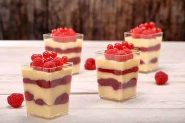 Cream pudding with red currants and raspberries