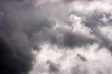 light in the dark and dramatic storm clouds