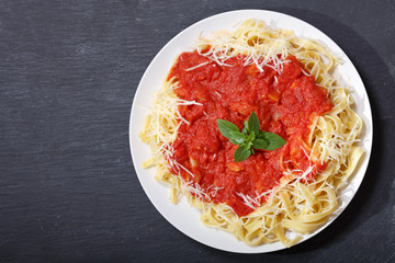 plate of pasta with tomato sauce, top view