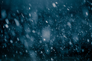 Snowflakes against black background for adding falling snow texture into your project. Add this picture as 