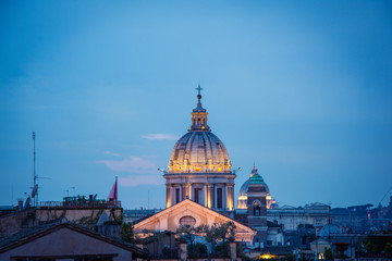 Fototapeta na wymiar Blue hour view of the Basilica of Saints Ambrose and Charles the Corso, Rome