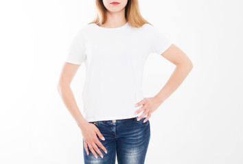 Fototapeta premium cropped portrait of young girl in tshirt. T-shirt design, people concept - closeup of woman in white shirt, front isolated. Mock up template for design print. Copy space