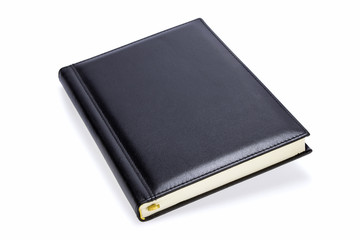Black luxury notebook with shadow on white