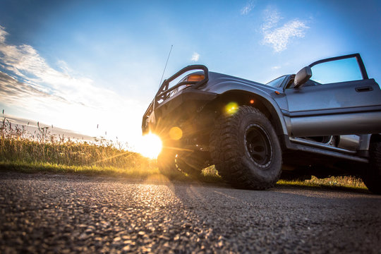 Sun set time jeep on the road