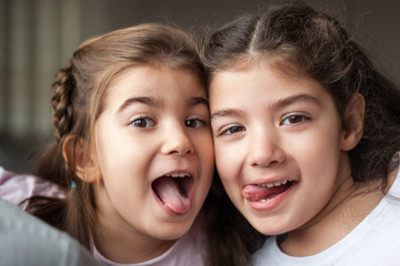 Sisters having fun making silly faces