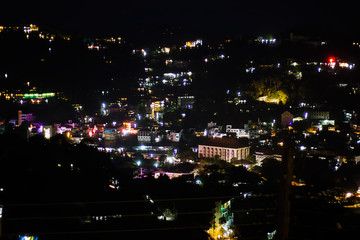 View of the city of Kandy in the illumination at night.