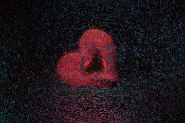 Broken heart and love.Broken glass in the background