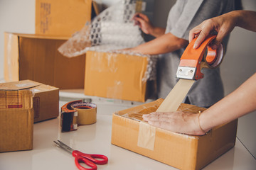 Team staff packed in brown boxes to deliver to customers