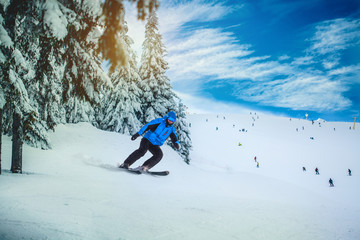 Man skier on a slope in the mountains